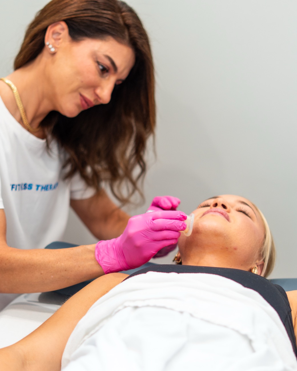 Lara treating a client